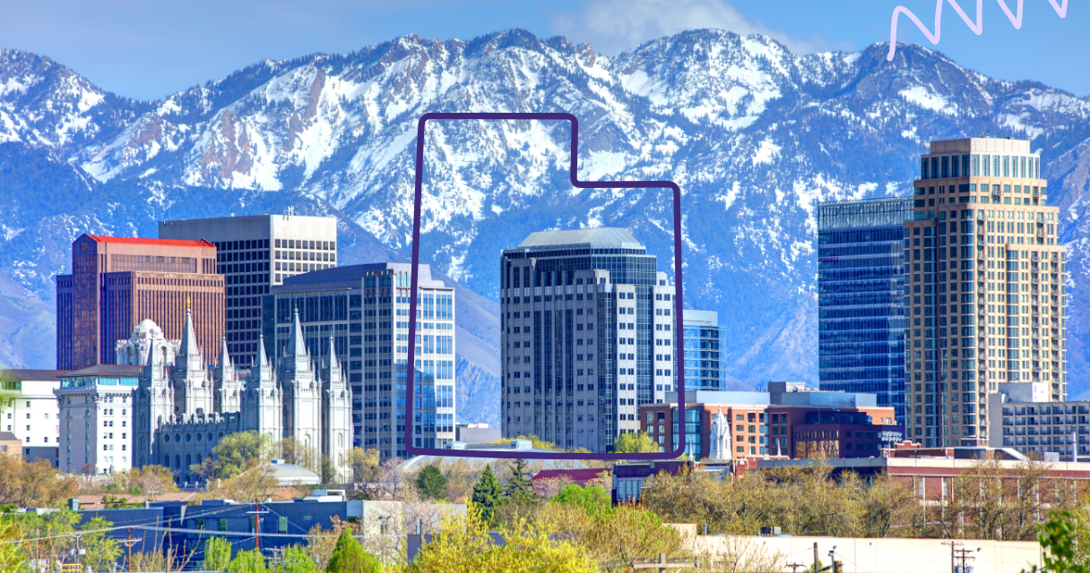 Skyline of Salt Lake City, Utah, with snow-capped mountains in the background.