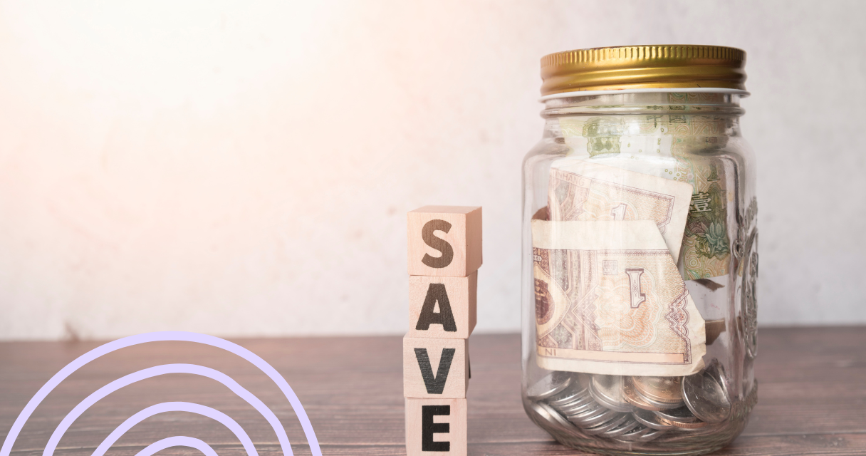 Glass jar filled with cash and coins, labeled 'Save,' symbolizing the importance of an emergency savings fund