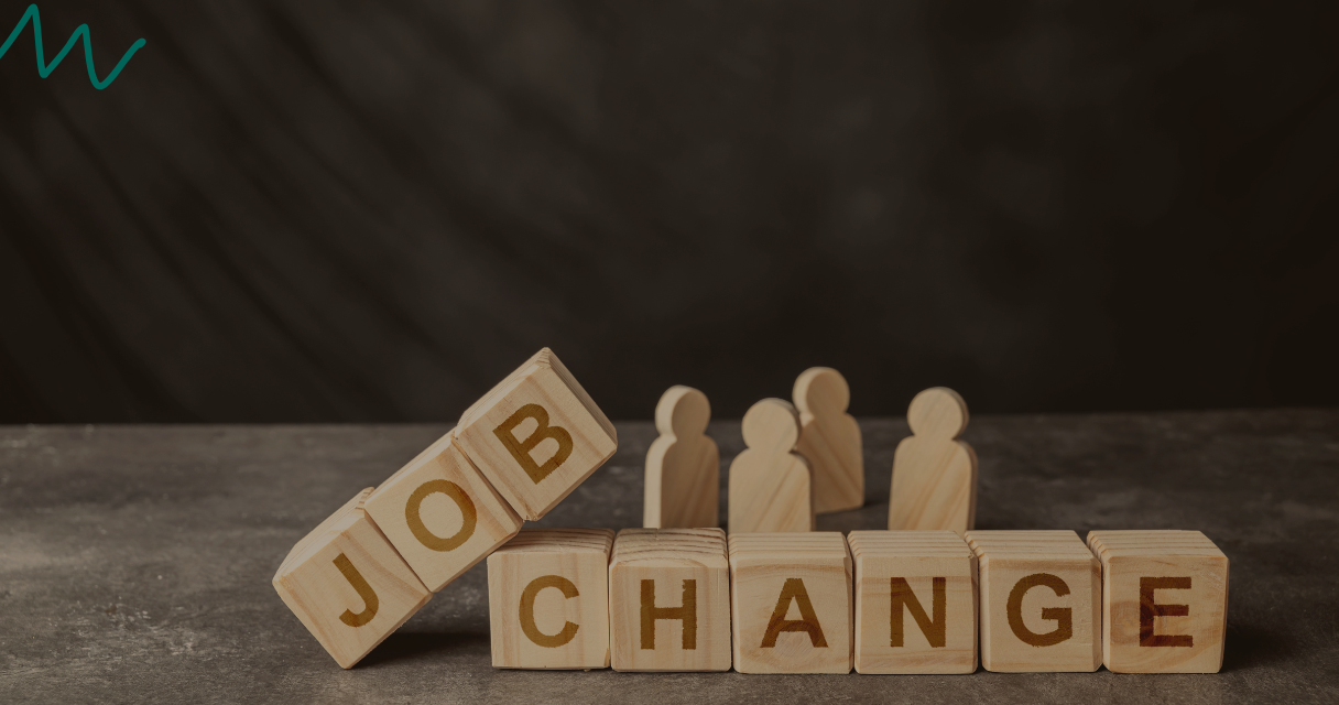 Wooden blocks spelling out “job change” with small wooden figures in the background, representing what happens if you are switching jobs with payroll loan.